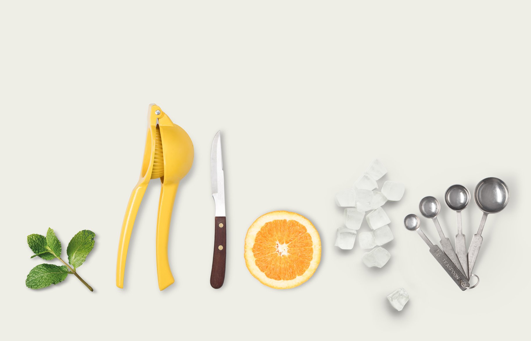 mint squeezer knife orange slice ice measuring spoon photography